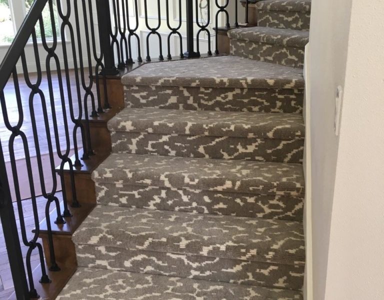 Cumulus Cloud, Color: Dark Sky 44/55221 installed on stairs. Cumulus Cloud is a cut/loop pile wilton carpet using two colors designed to create a cloud effect.