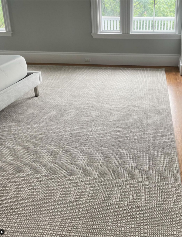 Grand Central - Image courtesy of The Carpet Workroom, Needham, MA Grand Central rug in room with furnishings. Grand Central is a large plaid design. Image courtesy of The Carpet Workroom, Needham, MA