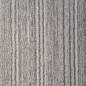 Discontinued color - Lineka Santana 55019/613 color swatch. Lineka is a cut pile with a linear pattern running down the length of the carpet. The linear design is created by varying yarn colors going across the width of the carpet. This colorway has colors of beige and tan.
