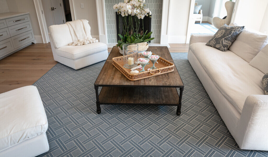 Brisa rug, Color: Lt Denim 17/5740 shown in family room with furnishings and flowers on table. Image credit: The Beaubelle Group, Orinda, CA