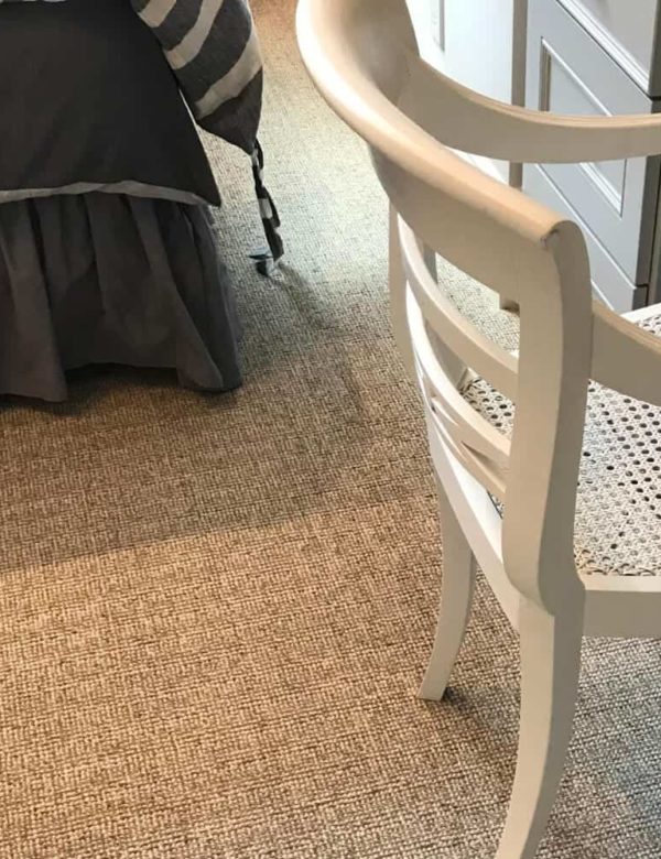 Eco Tweed 1855A install Eco Tweed 1855A install shown with chair and other furnishings. Eco Tweed is tufted as a textured loop pile two colors of heathered yarns to create a grid like pattern.