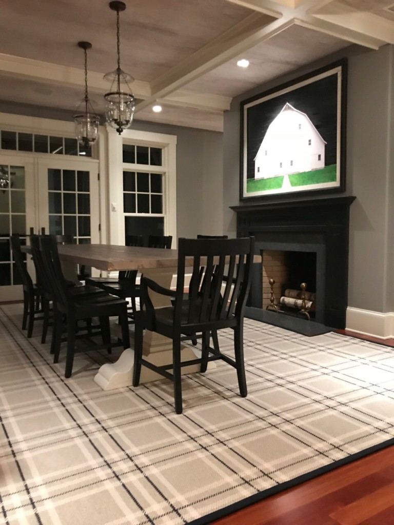 L-Squared rug, Color: Heather Steel 33/5710 in dining room with furnishings. L-Squared is a flatweave fabricated with heathered yarn in background and 2 dominant top colors (charcoal/white) to create a plaid design. Image credit to Seldom Scene Interiors, Stowe, VT