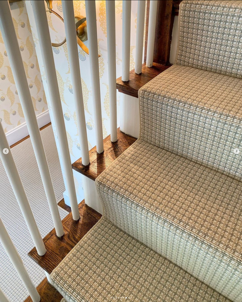 Ainsley, Color: Lowland Green 3/5760 on stairs. Ainlsey is a three color, small grid design. Image credit: Mary Snow Designs and Landry and Acari