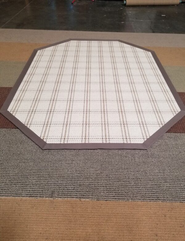 Hensley rug, Color: Cream 720/1520. Rug has an octagon shape and finished with wide cotton binding. Hensley rug, Color: Cream 720/1520. Rug has an octagon shape and finished with wide cotton binding.