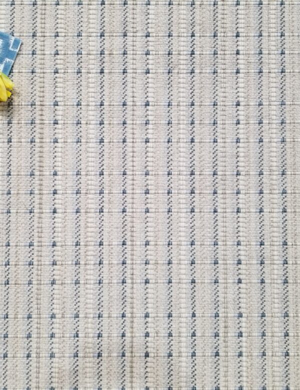 Traverse, Color: Blue Stone 27/5778 shown with props Traverse, Color: Blue Stone 27/5778 shown with flower and fabric swatches used as props.