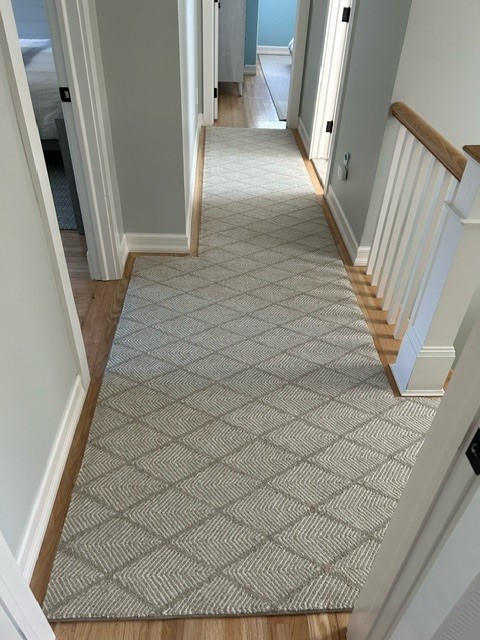 Pinnae, color: 570/1516 Steel Ivory installed in hallway and stairs Pinnae, color: 570/1516 Steel Ivory installed in hallway and stairs