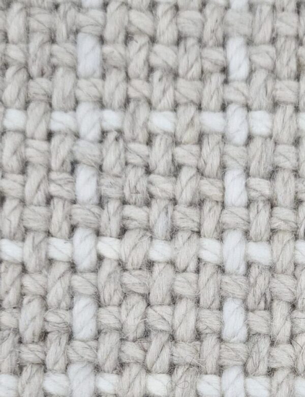 Boulevard, color: Cream 720/1564 showing close view Boulevard, color: Cream 720/1564 showing close view. Boulevard is broadloom with a grid-like pattern created by a background of cream heathered yarns and white top-stitch.